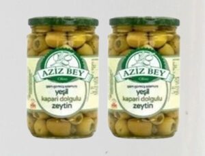 stuffed green olives with capers in glass jars